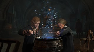 Two young wizards examining a cauldron